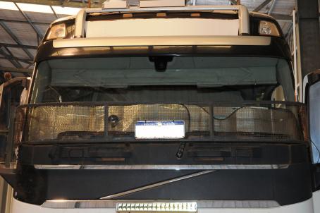Truck with non-original sun visor fitted at base of window (SIS No. 3)